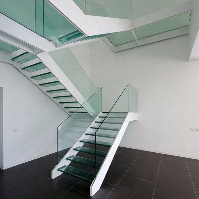 contemporary elegant glass Stairs with white double stringer and glass steps and glass railings 