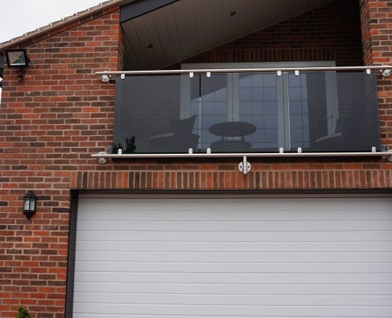 Glass juliette balcony railing with 48mm dia top and bottom rail 
